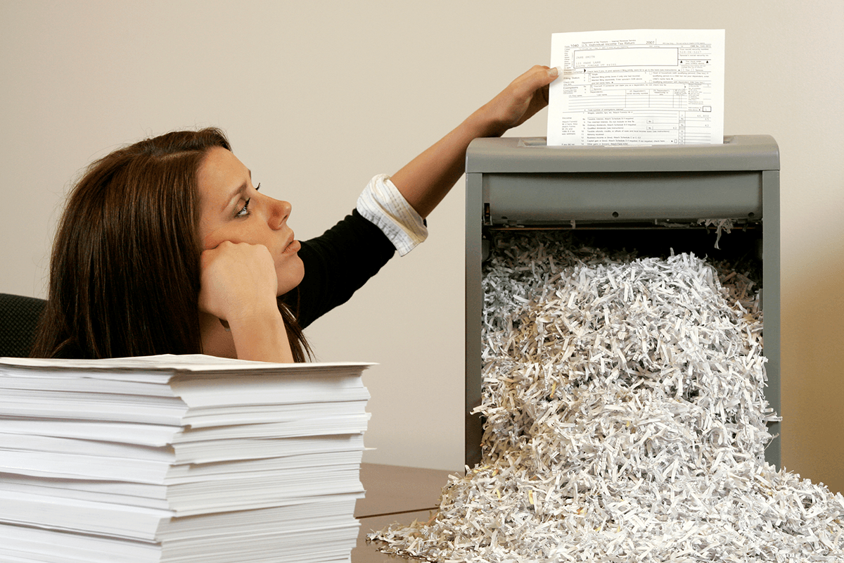 girl shredding paper